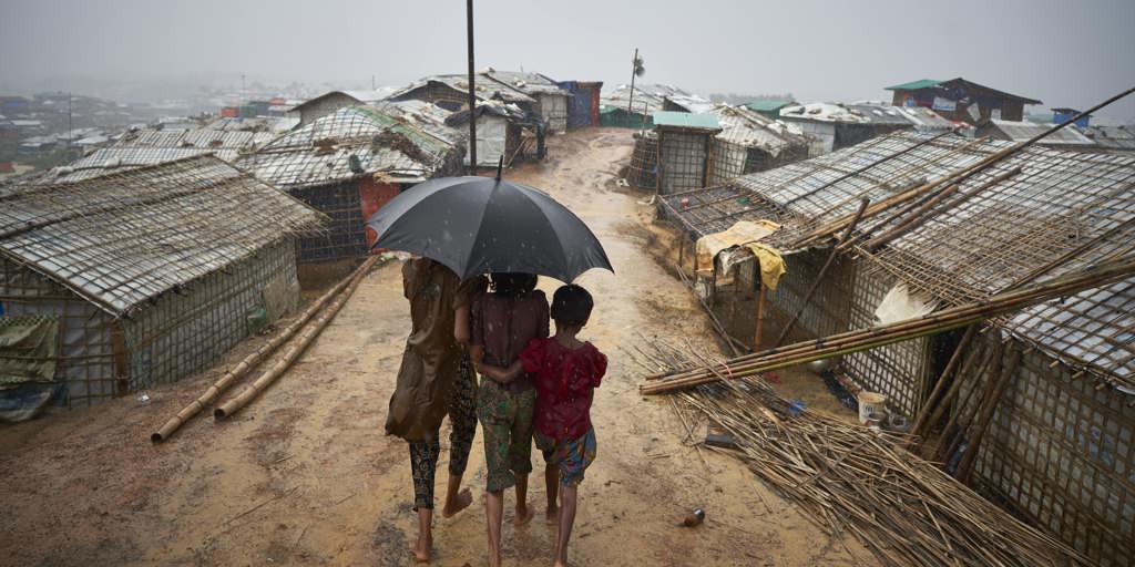 Bangladesh. Rohingya Refugees Walk Through A Heavy Downpour 