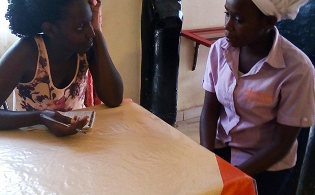 Mercy (right) meets the career counsellor at the vocational training centre at Kyaka II