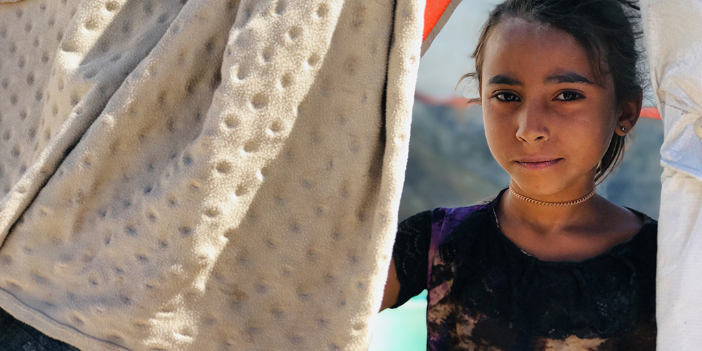 A young girl faces camera © UNHCR/Arwa Al Sabri