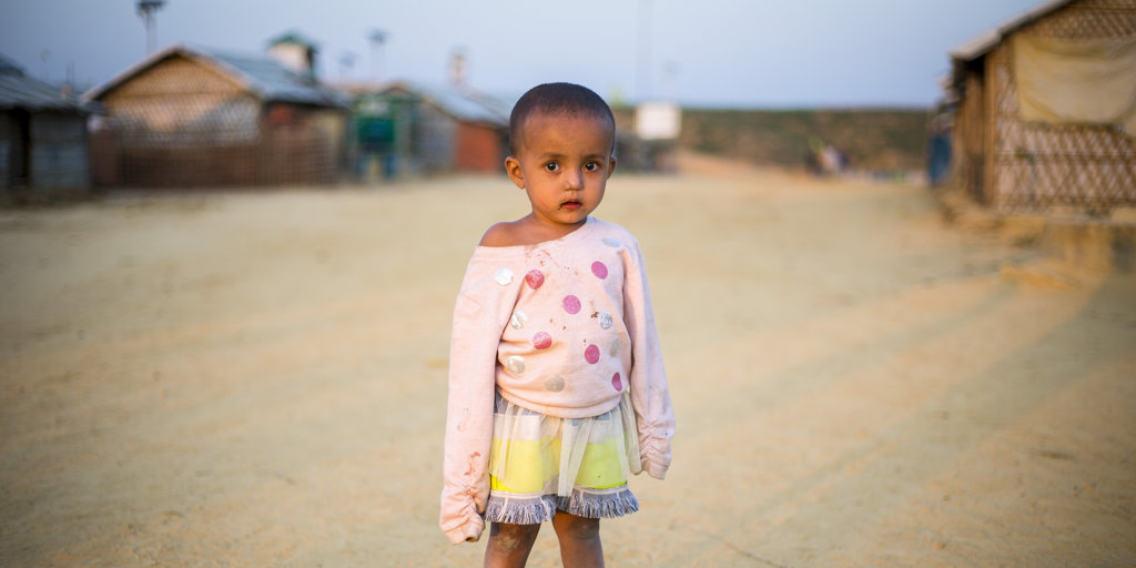 A young child stands outside shelters in Camp 4 Extension, Kutupalong Refugee Camp, south-east Bangladesh.