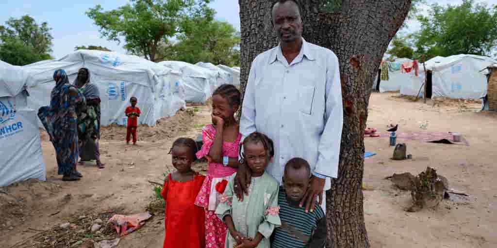 Mohammed, who fled the violence in Sudan, with four of his children at a camp in Central African Republic