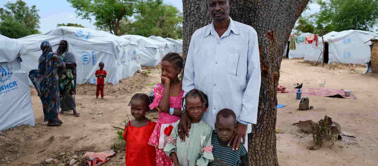 Mohammed, who fled the violence in Sudan, with four of his children at a camp in Central African Republic