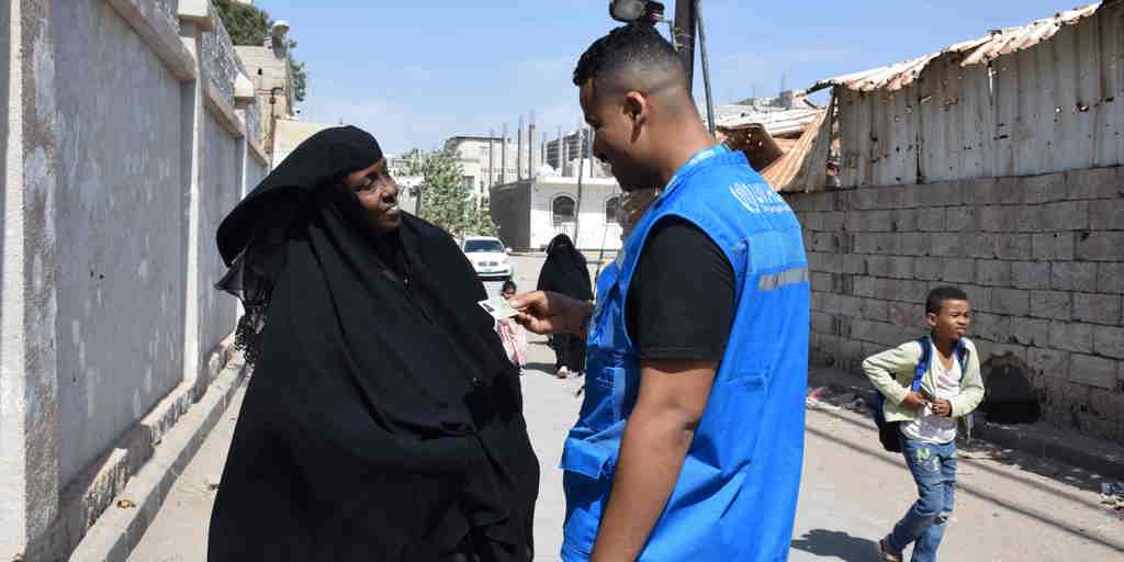 Somali refugee Ayan receives a valid identity document from UNHCR in Yemen