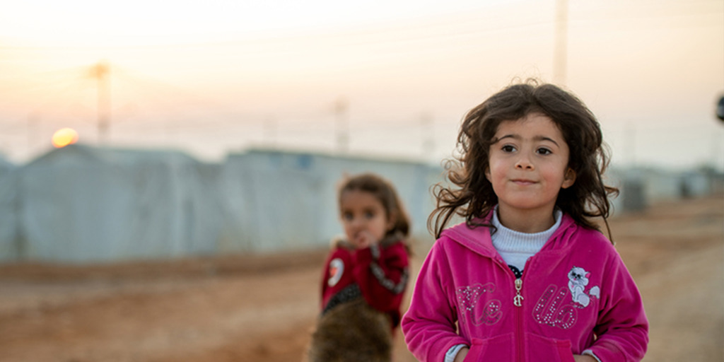 Syrian refugee children play in the streets in Azraq camp, Jordan.