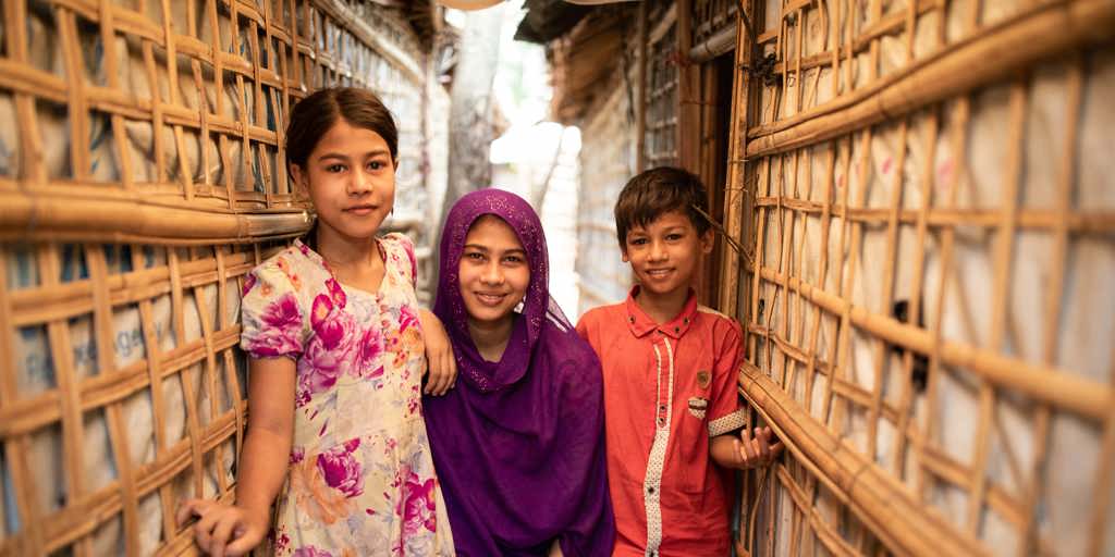 Rohingya refugee Ayesha cares for her younger brother and sister in a Cox’s Bazar refugee settlement.