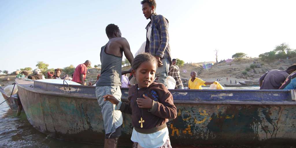Ethiopian refugees fleeing clashes in the country's northern Tigray region, cross the border into Hamdayet, Sudan.