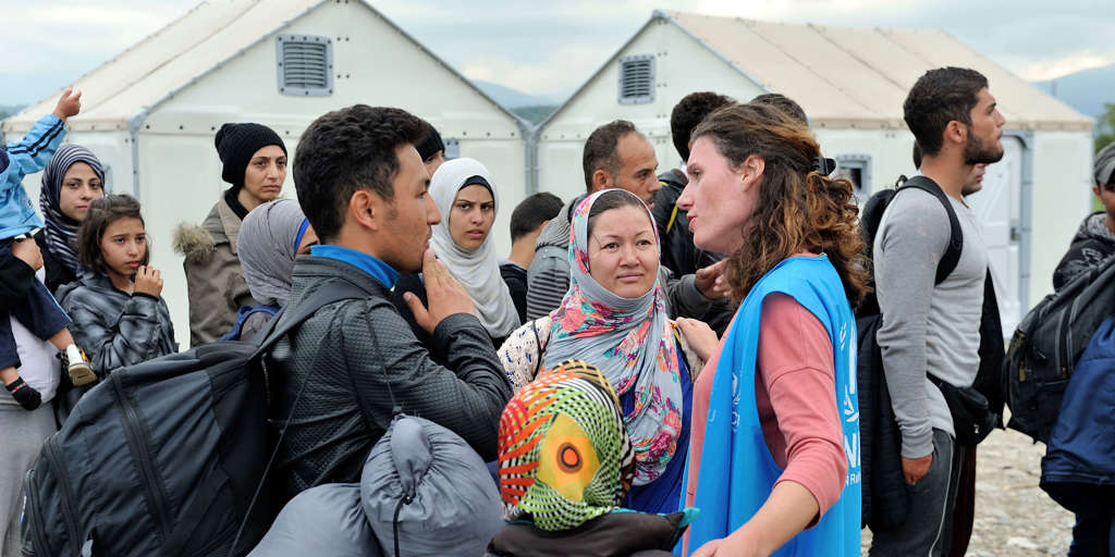 Alexandra Krause, Senior Emergency Coordinator, at work in Former Yugoslav Republic of Macedonia. Talking with Afghan refugees waiting to enter Vinojug Reception Centre near the border with Greece.