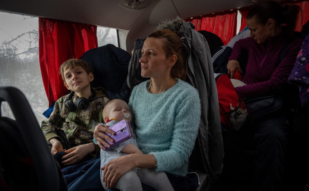 Natalia, 35, from Mykolaiv in southern Ukraine travels with her two children on a bus from the Moldovan border town of Palanca to Hu?i in Romania.