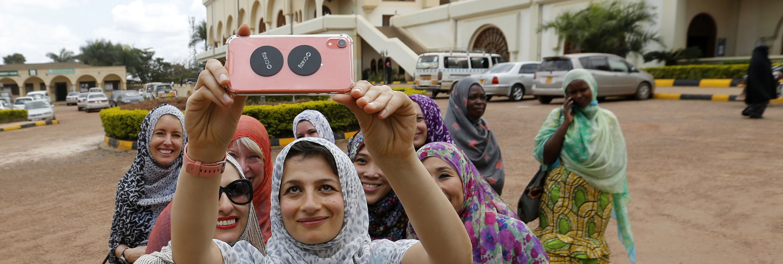 Zoe Ghani takes a selfie with women in Uganda