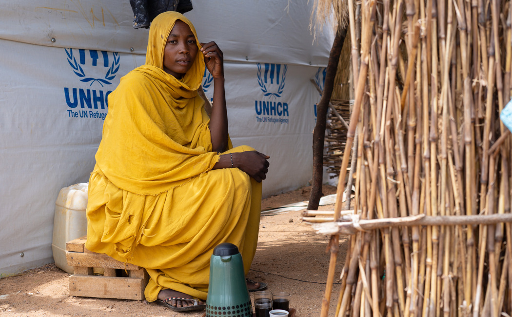 Zeinab prepares coffee in her new shelter in a refugee camp in Chad.