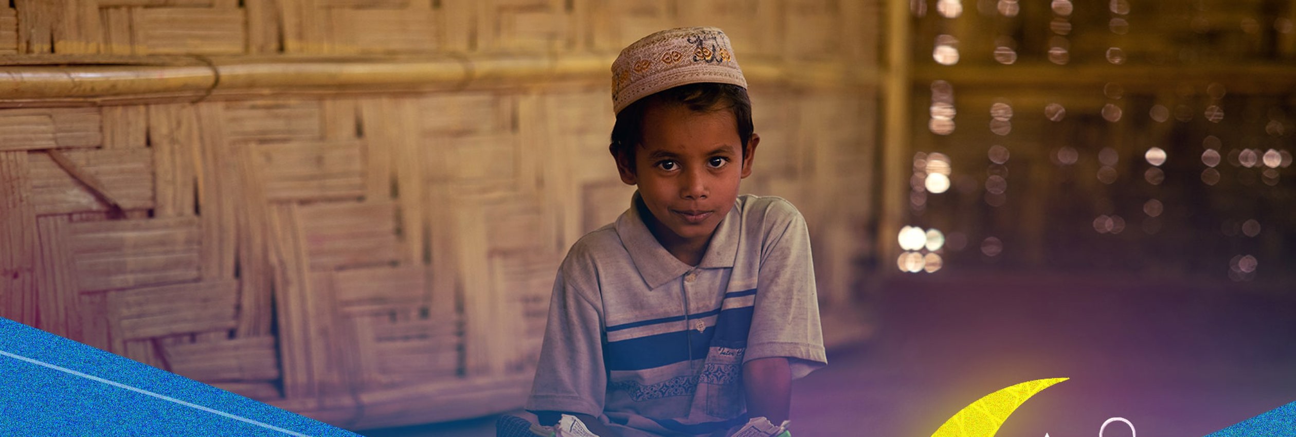 Rohingya refugee boy with a book