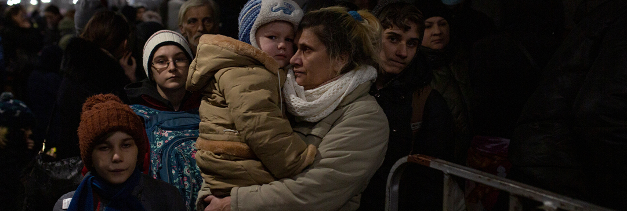 Mother holds baby © UNHCR / Valerio Muscella