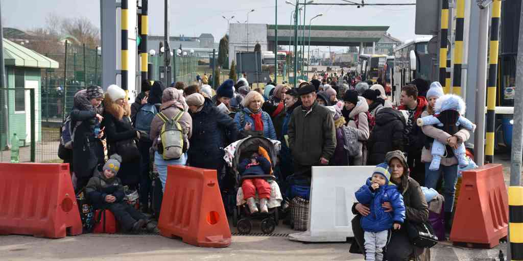 People fleeing Ukraine enter Poland at the Medyka border crossing.