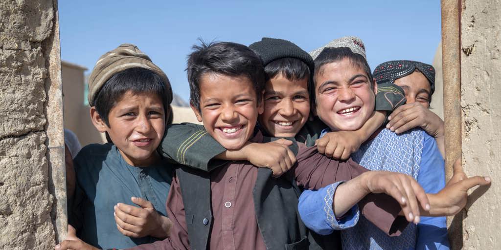 Children from internally displaced families play at a settlement for displaced people in Loya Wala north of Kandahar, Afghanistan.